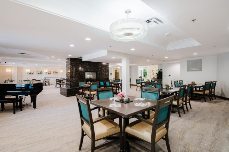 Bright and inviting dining area, featuring elegant decor and comfortable seating, fostering community warmth.