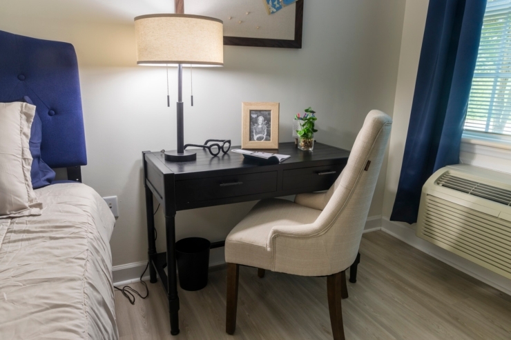 A serene corner featuring a stylish desk, comfortable chair, and personal touches, inviting relaxation and connection.