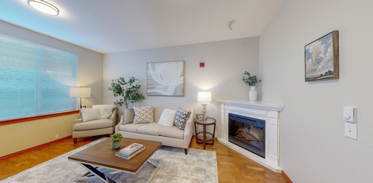 A cozy living space filled with warmth, featuring comfortable seating and soft lighting, perfect for community gatherings.