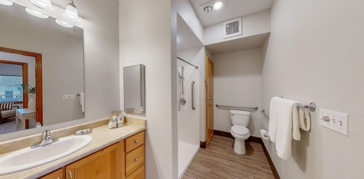 A bright, welcoming bathroom designed for comfort and accessibility, promoting a sense of community.