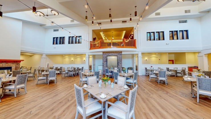 Bright and welcoming dining area, featuring elegant tables, cozy seating, and a warm, inviting atmosphere.