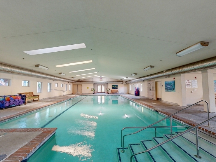 Bright and inviting indoor pool area, perfect for relaxation and community activities.