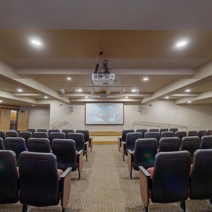 A welcoming theater space with comfortable seating, perfect for community gatherings and shared moments.