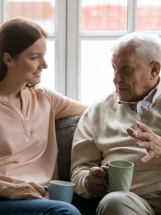 A warm conversation unfolds on a comfortable couch, highlighting connection and companionship.