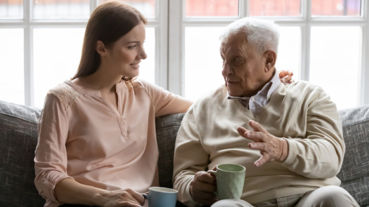 A warm conversation unfolds on a comfortable couch, highlighting connection and companionship.