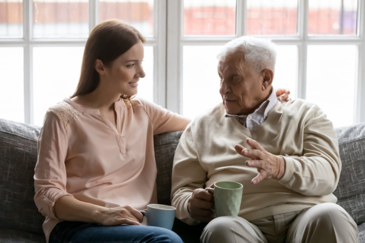 A warm conversation unfolds on a comfortable couch, highlighting connection and companionship.