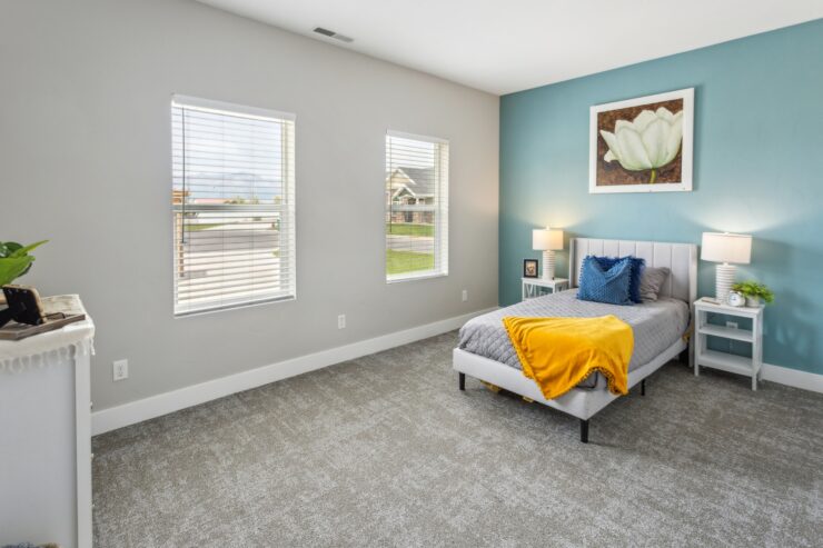 Bright, inviting room featuring soft furnishings and natural light, perfect for relaxation and community.