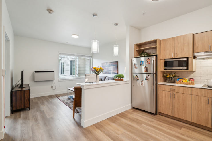 Bright and inviting, this cozy kitchen-living area fosters warmth and community, perfect for connection.
