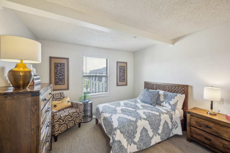 A welcoming bedroom filled with natural light, featuring cozy furnishings and thoughtful decor.