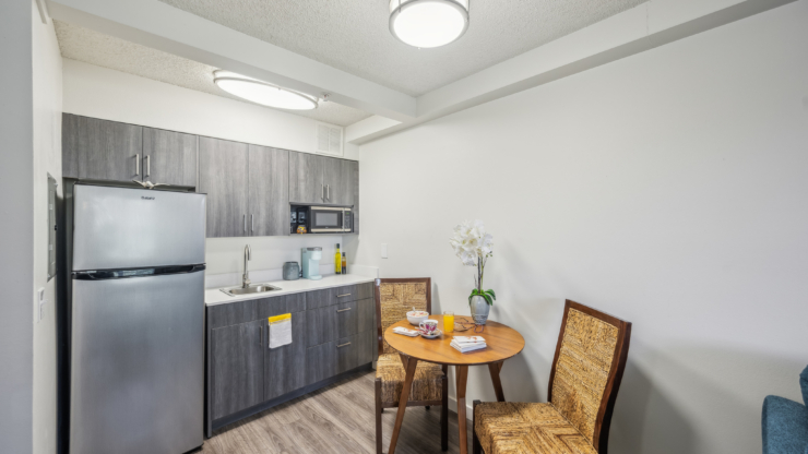 A welcoming kitchen corner with a dining table, inviting atmosphere for meals and connection.