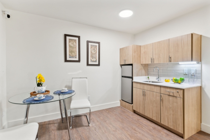 A bright, inviting kitchen area with elegant decor fosters a sense of community and comfort.