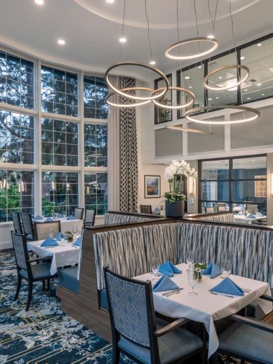 Bright and inviting dining area, featuring elegant decor and a warm atmosphere for community gatherings.