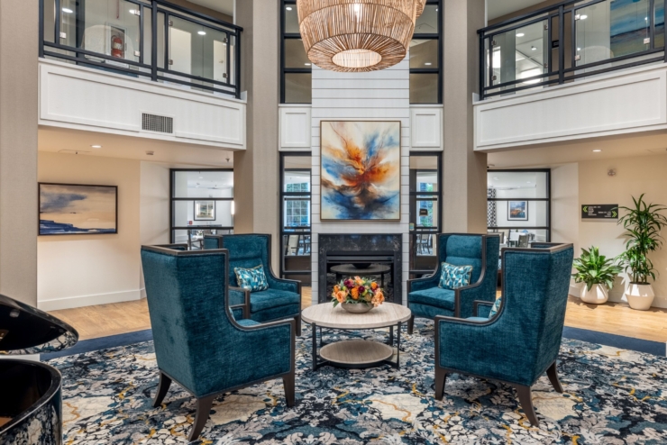 A cozy, inviting lounge features plush seating and vibrant decor, fostering warmth and community among residents.