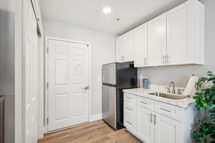 A cozy kitchen space featuring modern appliances, inviting warmth, and community comfort.