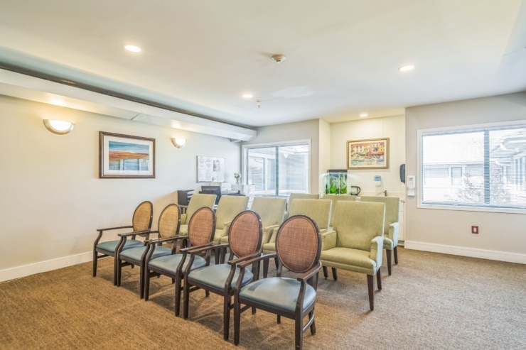A cozy, inviting lounge area with comfortable seating, warmly lit, fostering community and connection.
