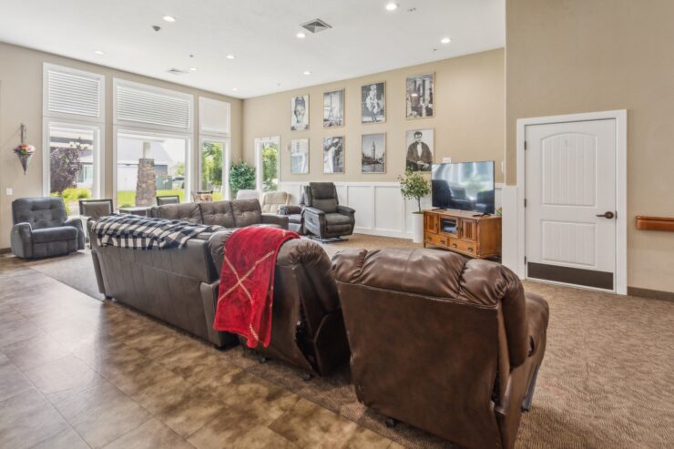 A welcoming lounge filled with comfortable seating, natural light, and community spirit.