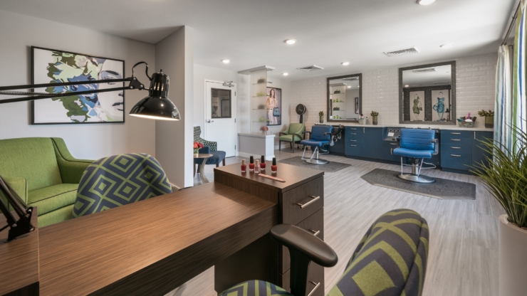 A welcoming salon space with vibrant decor, inviting seating, and a warm atmosphere for community bonding.