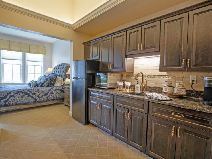 Cozy kitchenette and inviting bedroom create a warm, welcoming atmosphere for residents.