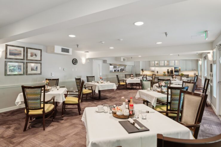 Bright and inviting dining area, fostering community and comfort, with elegant tables and cheerful decor.