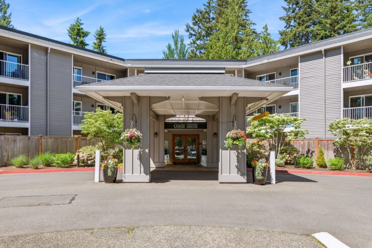 Welcoming entrance with vibrant flowers, inviting a warm sense of community and comfort.