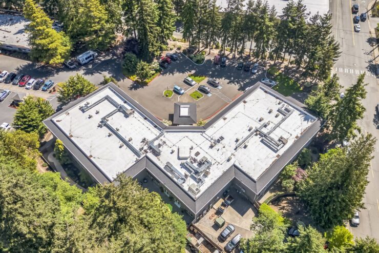 A welcoming community surrounded by lush trees, offering a peaceful atmosphere for residents.