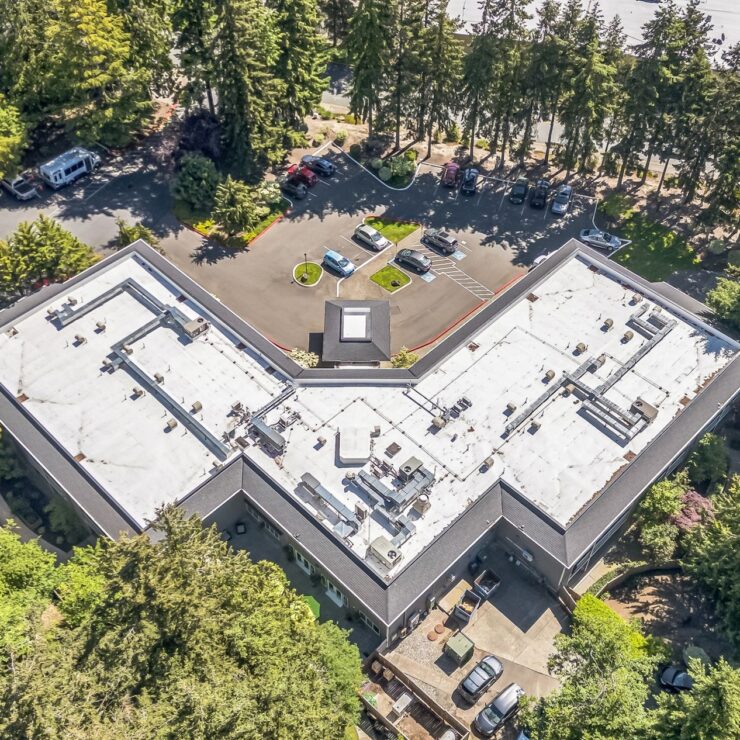 A welcoming community surrounded by lush trees, offering a peaceful atmosphere for residents.