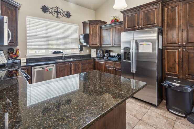 Warm wood tones and modern appliances create a welcoming kitchen, perfect for gathering and comfort.