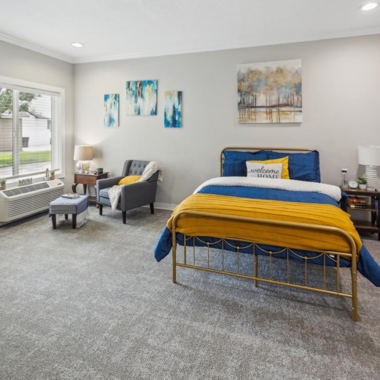 A bright, inviting room with a warm atmosphere, featuring comfortable furnishings and cheerful decor.