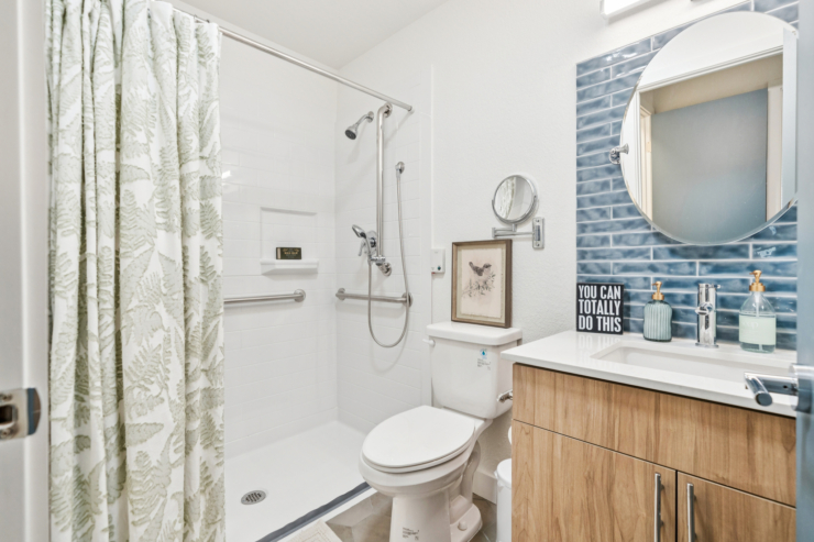 A bright and inviting bathroom featuring modern amenities, promoting comfort and independence.