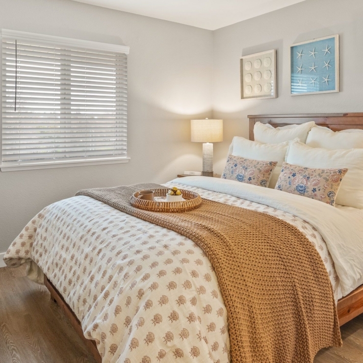 A welcoming bedroom filled with warmth, perfect for relaxation and fostering community connections.