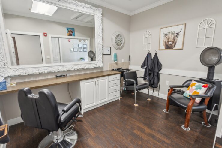 A welcoming salon space with comfortable chairs and a friendly atmosphere, perfect for community bonding.