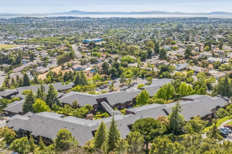 A serene community nestled among lush greenery, offering a welcoming atmosphere and beautiful views.