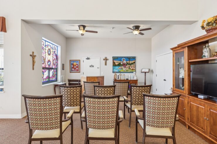 A welcoming space with comfortable seating, vibrant artwork, and a serene atmosphere for community gatherings.
