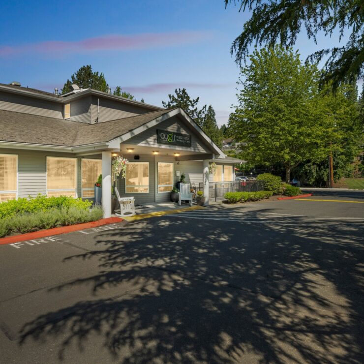 A welcoming entrance surrounded by lush greenery, inviting residents to enjoy a vibrant community.