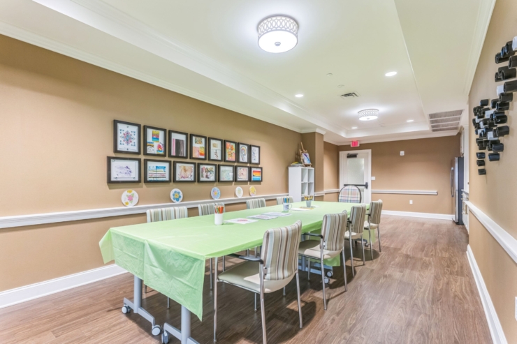 A welcoming activity room filled with vibrant art, fostering community and creativity.
