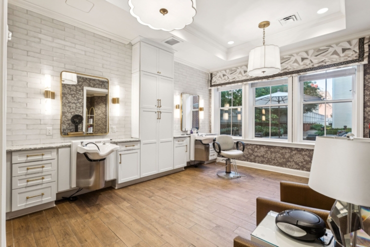 Bright and inviting, this charming salon features elegant decor, natural light, and a welcoming ambiance.
