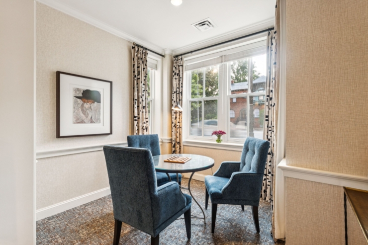 A bright, inviting space with comfortable seating invites friendly conversations and community connection.