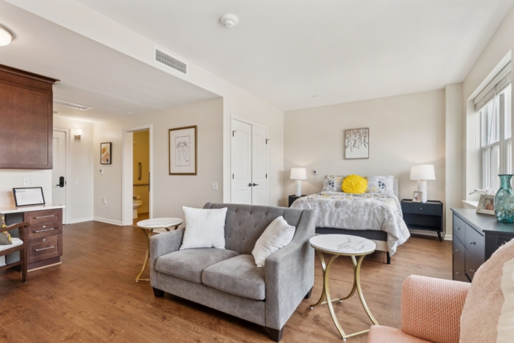 A bright, welcoming room featuring soft furnishings and warm accents, inviting relaxation and community.