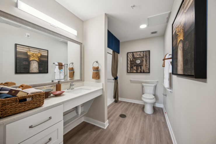 A bright, welcoming bathroom featuring elegant decor, ensuring comfort and ease for residents.