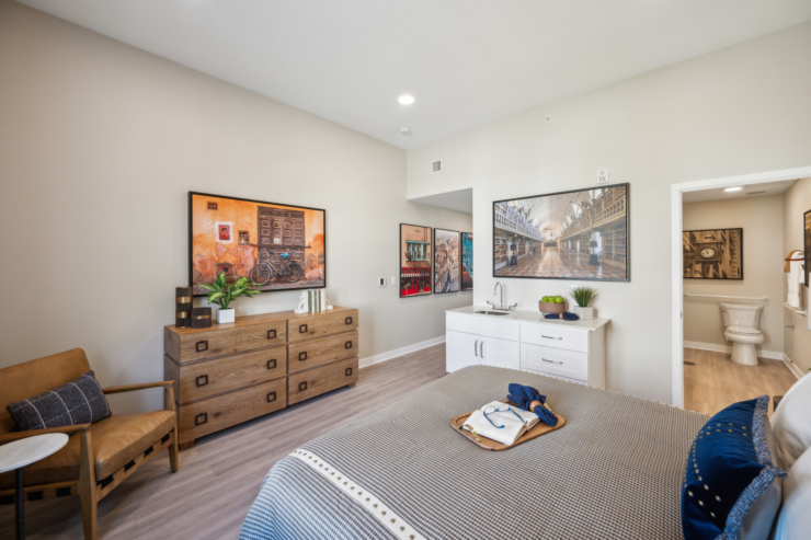 A cozy, inviting room featuring warm decor, comfortable furnishings, and a sense of community.