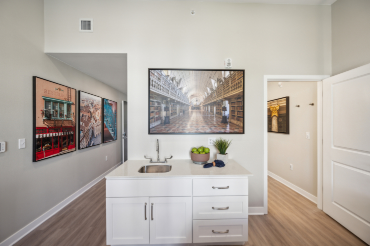 Bright, inviting space featuring community art and a charming kitchenette, perfect for social gatherings.
