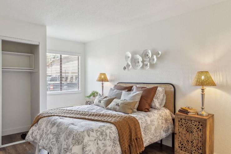 A cozy, inviting bedroom filled with warmth, featuring soft textiles and gentle lighting for comfort.