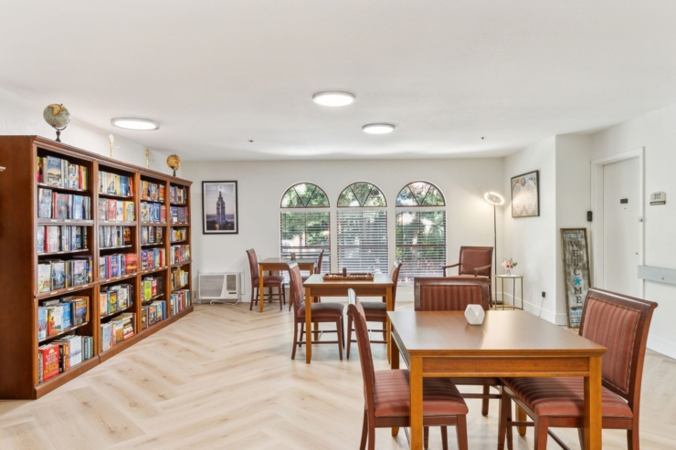 Bright, inviting space filled with books, comfortable seating, and natural light, fostering community spirit.