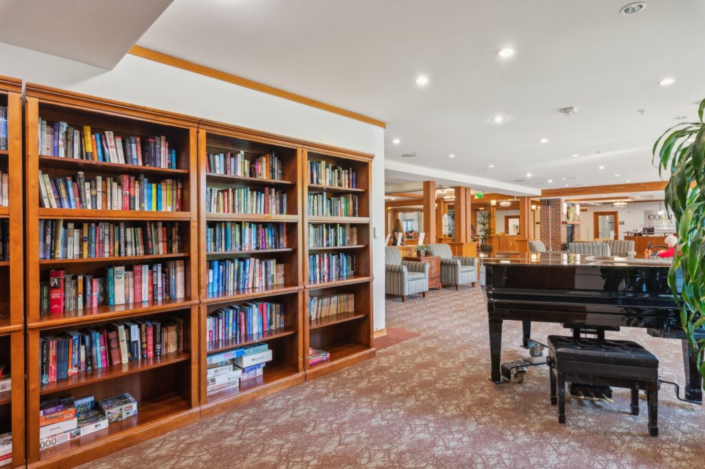 A welcoming library space with comfortable seating, inviting residents to relax and connect.