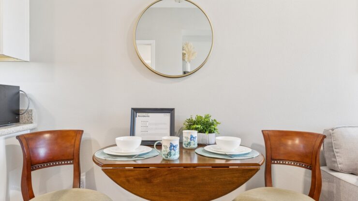 A welcoming dining area with a warm atmosphere, featuring a beautifully set table and comfortable seating.