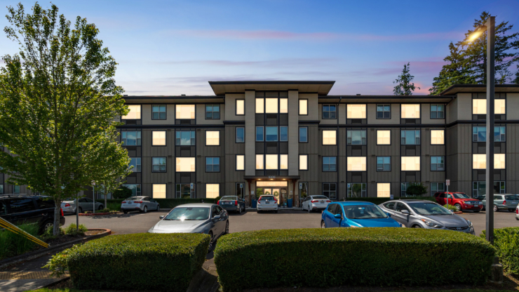 A welcoming community hub with vibrant landscaping, inviting residents to connect and enjoy life.