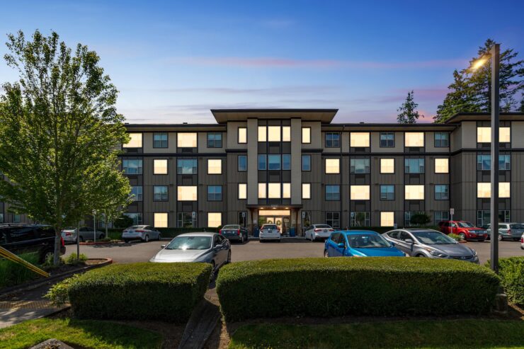 A welcoming residence surrounded by greenery, offering a serene atmosphere for community living.