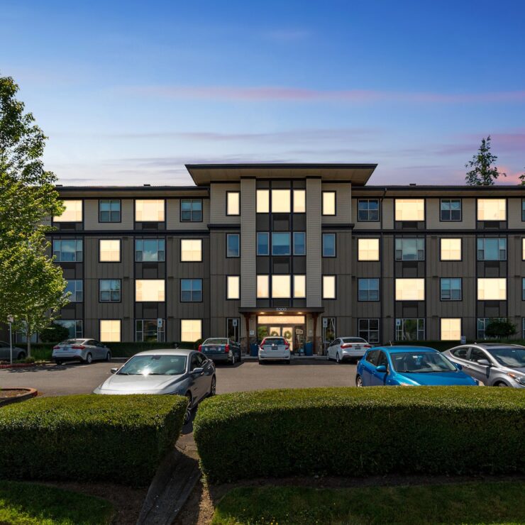 A welcoming residence surrounded by greenery, offering a serene atmosphere for community living.