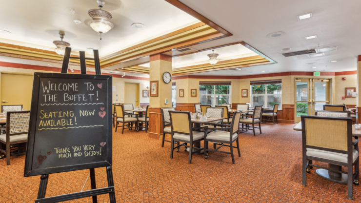 A welcoming dining space with cheerful decor, inviting residents to enjoy community meals together.