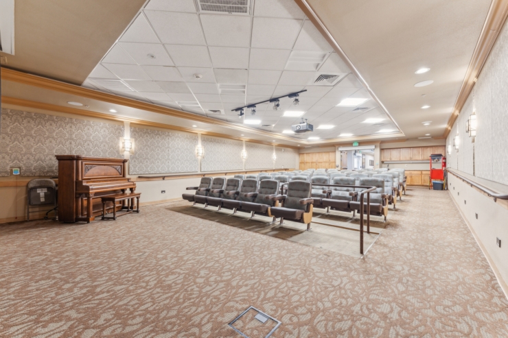 A welcoming space featuring comfortable seating and a piano, perfect for community gatherings and events.